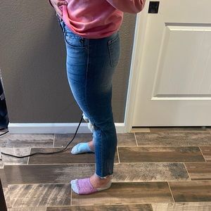 KanCan skinny heavy distressed knee jean